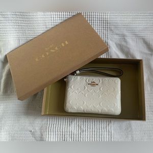 Coach cream corner zip wristlet